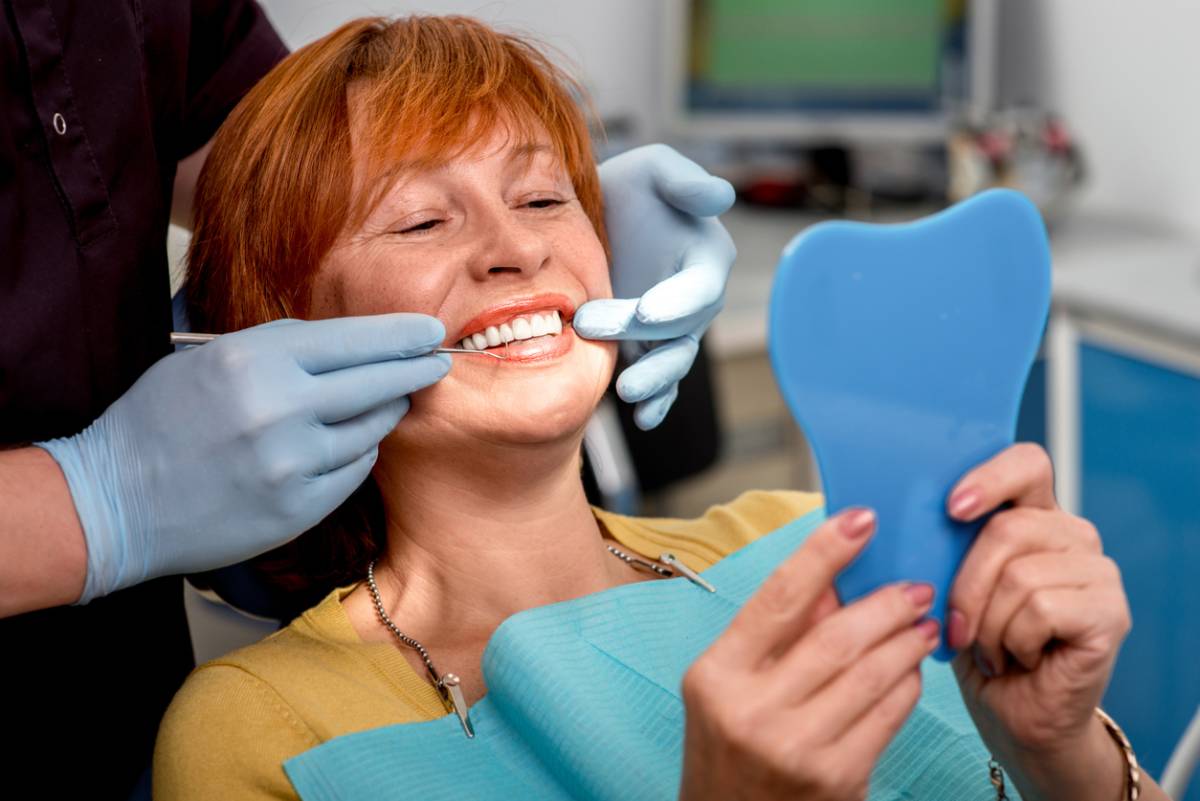 concept image of woman needing to fix dentures that don't fit